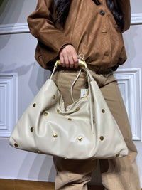 Borsa Lola Casademunt in pelle e con borchie oro